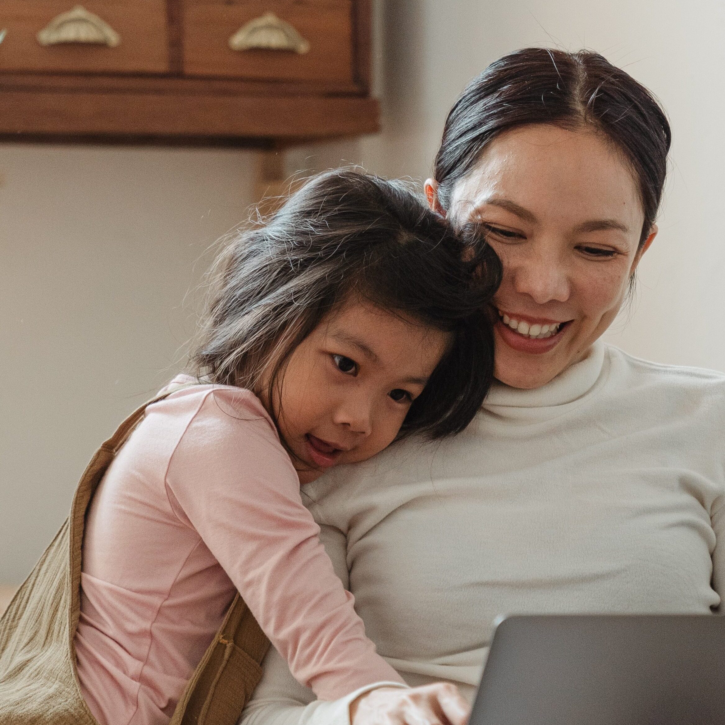 mom working with her daughter on the side