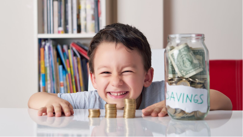 a boy is learning about savings