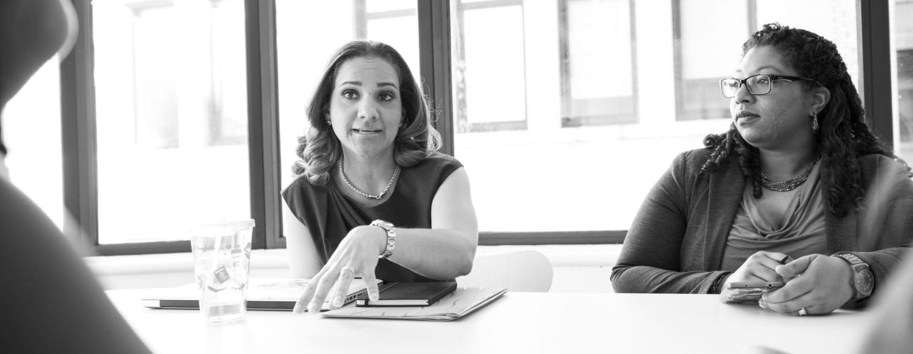 Certified Divorce Financial Analyst reviewing settlement options with a client