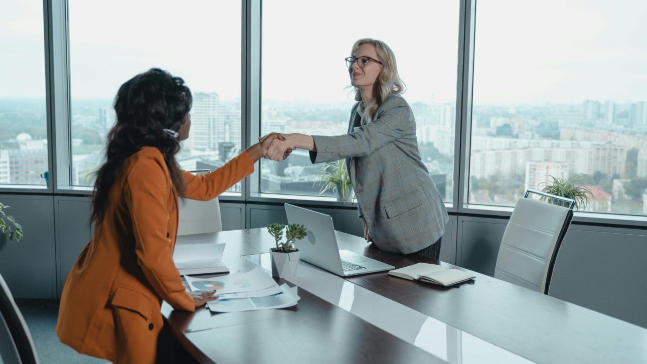 Financial advisor meeting one on one with a client to review her plan