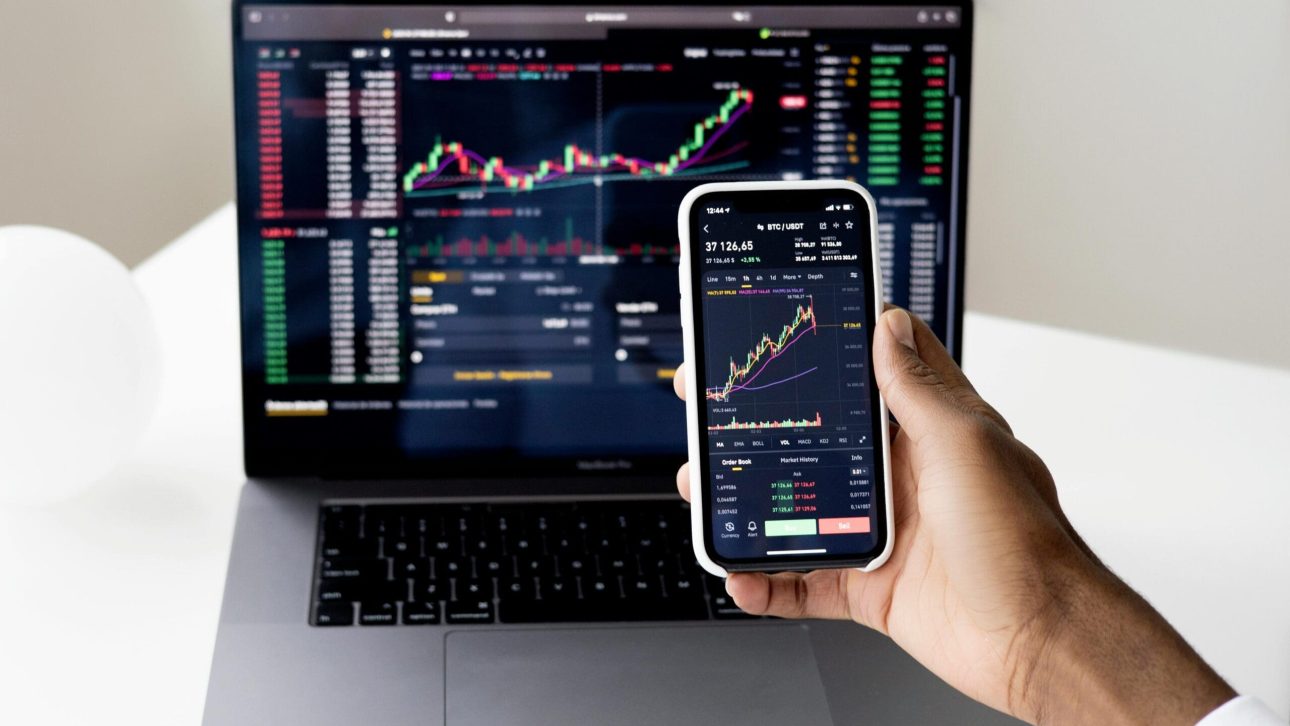 stock market chart on the laptop and phone
